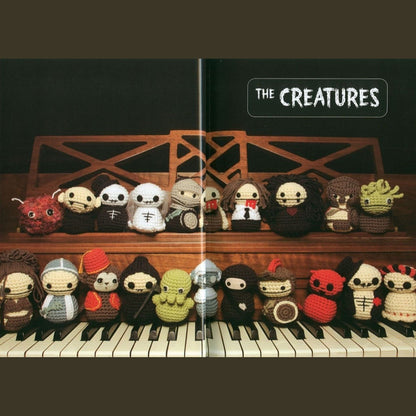 Creepy cute amigurumi zombies, ninjas, and robots arranged on piano keys with "The Creatures" text above.